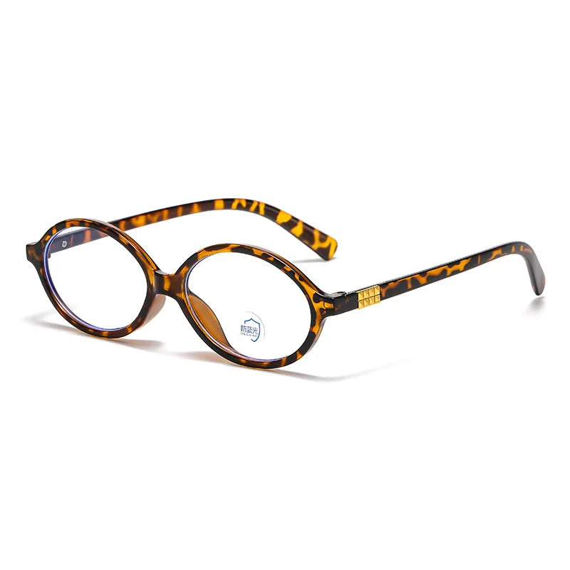 Side Blue Light Glasses Shine with Leopard tortoiseshell frame, oval-shaped design and clear blue light filter lenses. Lightweight and stylish, these glasses reduce eye strain, improve sleep, and protect your eyes from harmful screen glare. Ideal for long hours in front of computers, phones, and tablets. Comfortable for everyday wear with a premium look and smooth fit. Available now at www.zenluk.com