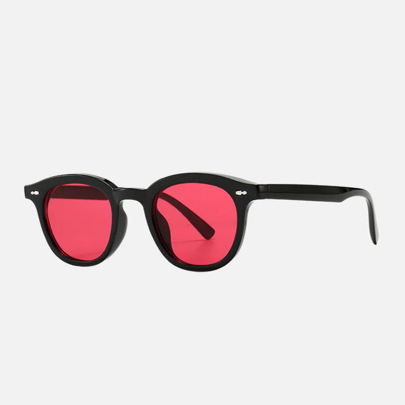 Sunglasses George Red – Side View – Elegant side profile of the George Red sunglasses, showcasing the glossy black acetate frame, round lens shape, and vivid red-tinted lenses that exude confidence and style. The metallic rivets at the temples and the slightly curved arms add both durability and comfort. Explore the full collection at www.zenluk.com