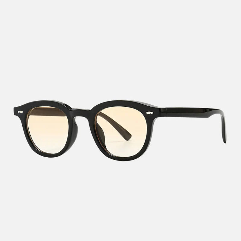 Sunglasses George Yellow – Front view of sophisticated black acetate round sunglasses featuring yellow gradient lenses, blending style and comfort for a modern yet classic appeal. Ideal for sunny days with a hint of golden warmth in the lens tone. Explore more at www.zenluk.com