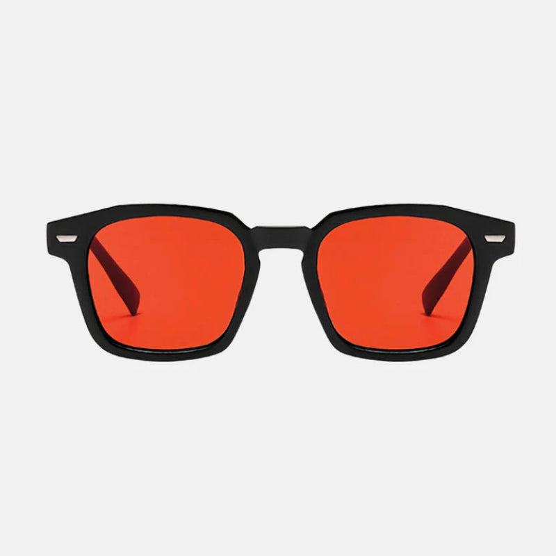 Sunglasses Noir Black – Orange lens rectangular sunglasses with slightly rounded edges, dark UV-protected lenses, subtle metallic accents on the upper corners, and straight temples. Minimalist and timeless design. Discover more at www.zenluk.com