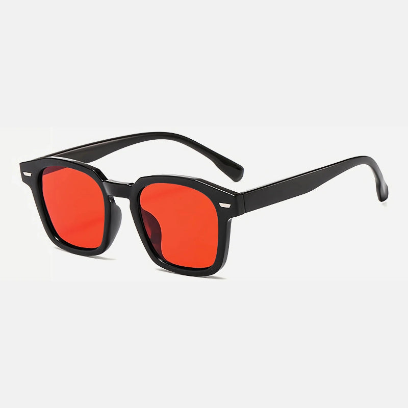 Sunglasses Noir Black – Orange lens rectangular sunglasses with slightly rounded edges, UV-protected lenses, discreet metallic detail near the hinges, and long, gently curved temples for comfort. Discover more at www.zenluk.com