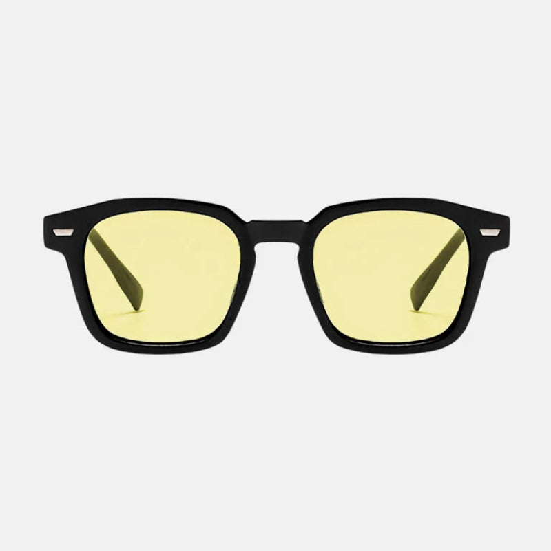 Sunglasses Noir Black – Yellow lens rectangular sunglasses with slightly rounded edges, UV-protected lenses, subtle metallic accents on the upper corners, and straight temples. Minimalist and timeless design. Discover more at www.zenluk.com