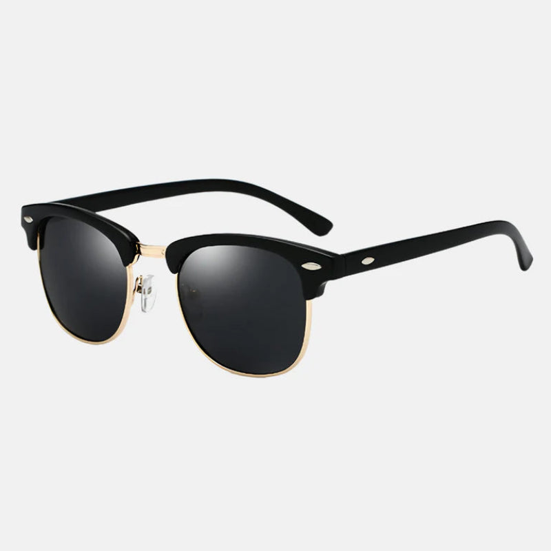 Sunglasses Ruby Black – side view showcasing the striking combination of a glossy black acetate top frame with elegant gold metal rims. The design features premium black polarized lenses, gold bridge detailing, and black temple arms with metallic accents for added style. A perfect blend of elegance and durability. Explore more at www.zenluk.com.
