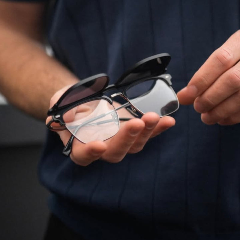 Sunglasses Solare Black showcasing the innovative 2-in-1 clip-on design with magnetic polarized black lenses placed over the clear semi-rimless frame, combining style, practicality, and modern elegance. Available at www.zenluk.com