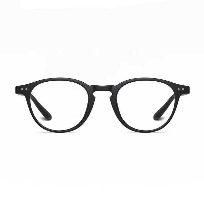 Blue Light Glasses Retro Black with matte black frame, round lenses, and modern minimalistic design. Built for everyday use, these glasses filter harmful blue light to reduce eye strain, improve focus, and support better sleep quality. Lightweight and durable with a comfortable fit, perfect for long hours at the office, on your phone, or during late-night screen time. A timeless choice for both men and women. Available now at www.zenluk.com