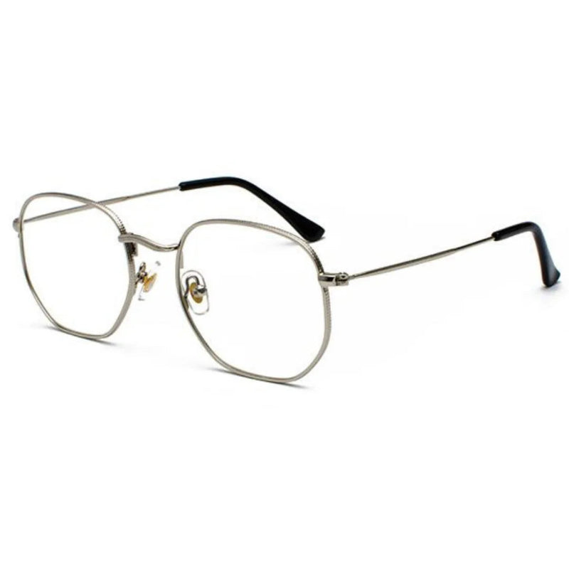 Blue Light Glasses Zoe Side with Silver metal frame. Designed to reduce eye strain from screens and improve visual comfort. Lightweight and elegant square shape with thin, durable temples. Adjustable nose pads for a secure and comfortable fit. Clear, anti-reflective lenses block harmful blue light while maintaining style and sophistication. Ideal for use with computers, phones, and tablets. Stylish unisex design, perfect for everyday wear or professional settings. Discover more at www.zenluk.com