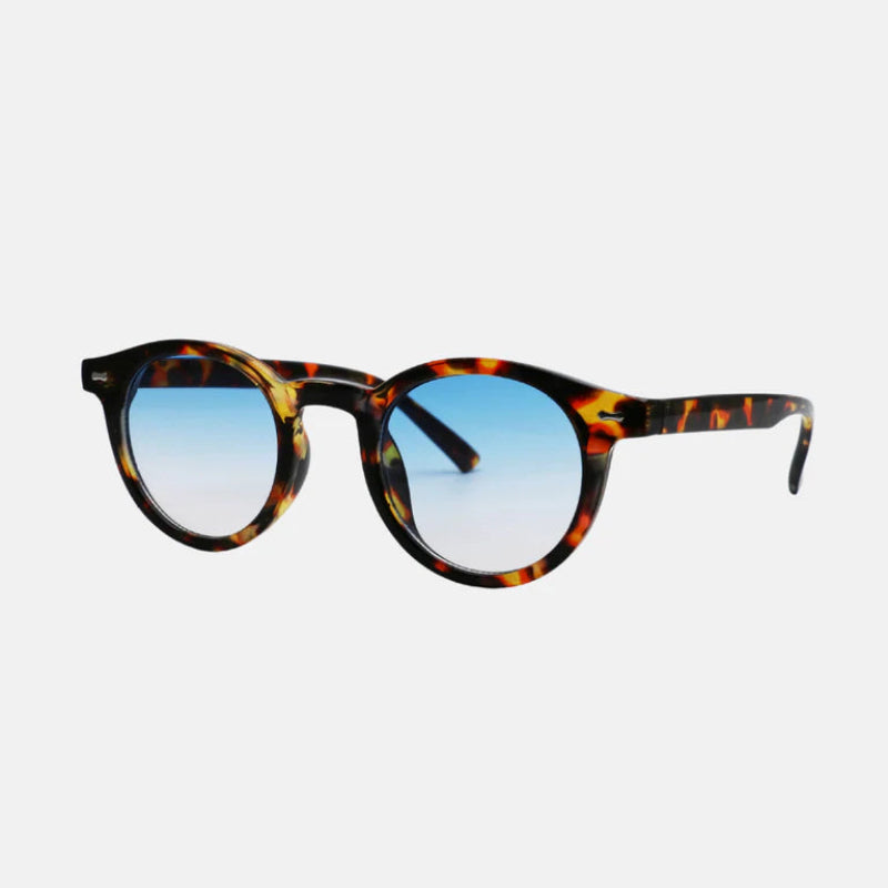 Sunglasses Vero Leopard Blue – front view showing the full tortoiseshell frame with a rich blend of golden amber and deep brown shades, matched with round blue gradient lenses. The keyhole bridge and sculpted temples add to its classic yet modern appeal. www.zenluk.com