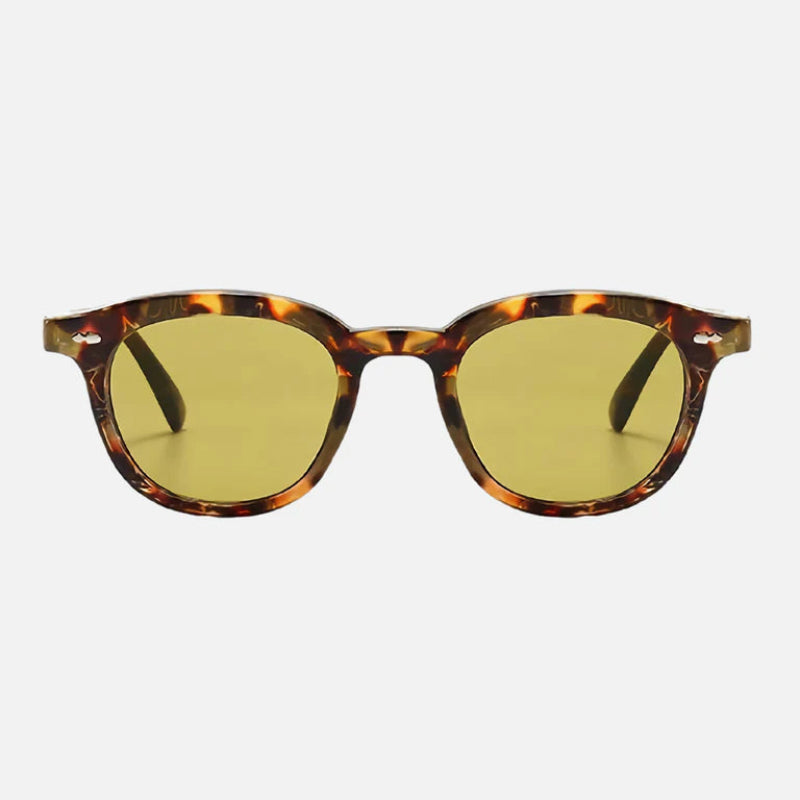 Sunglasses George Leopard – Stylish round sunglasses with a bold leopard-patterned acetate frame, featuring warm brown and amber tones. The lenses are tinted yellow for a modern, vibrant look, while the arms maintain the same leopard design with a sleek, polished finish. Ideal for a fashion-forward statement with everyday comfort. Available now at www.zenluk.com