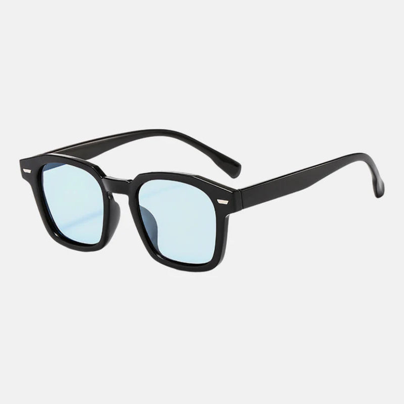 Sunglasses Noir Black – Blue lens rectangular sunglasses with slightly rounded edges,UV-protected lenses, discreet metallic detail near the hinges, and long, gently curved temples for comfort. Discover more at www.zenluk.com